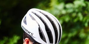 a man wearing a white specialized s works prevail 3