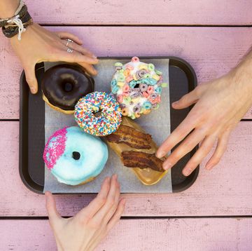 Specialty doughnuts on a tray.