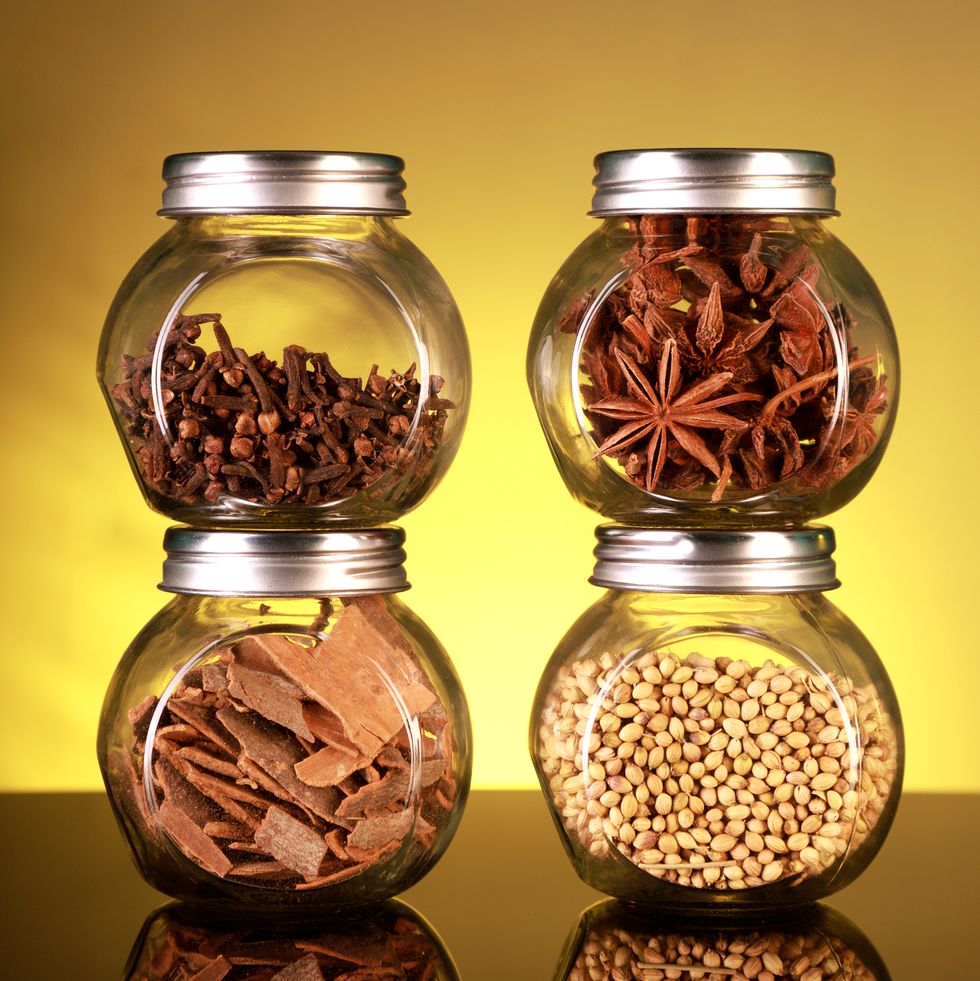 spice jars with star anise, cloves, cinnamon, coriander seeds