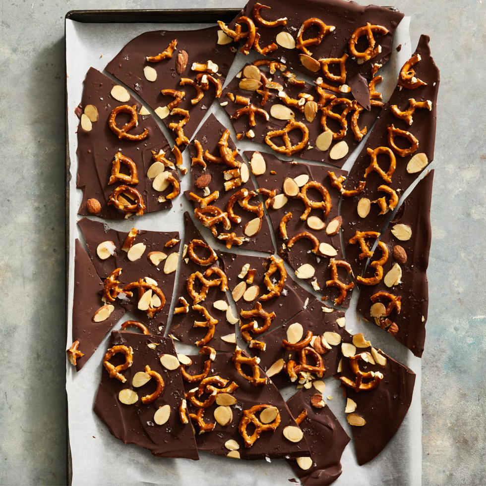 pieces of spiced chocolate bark with pretzels and almonds on top