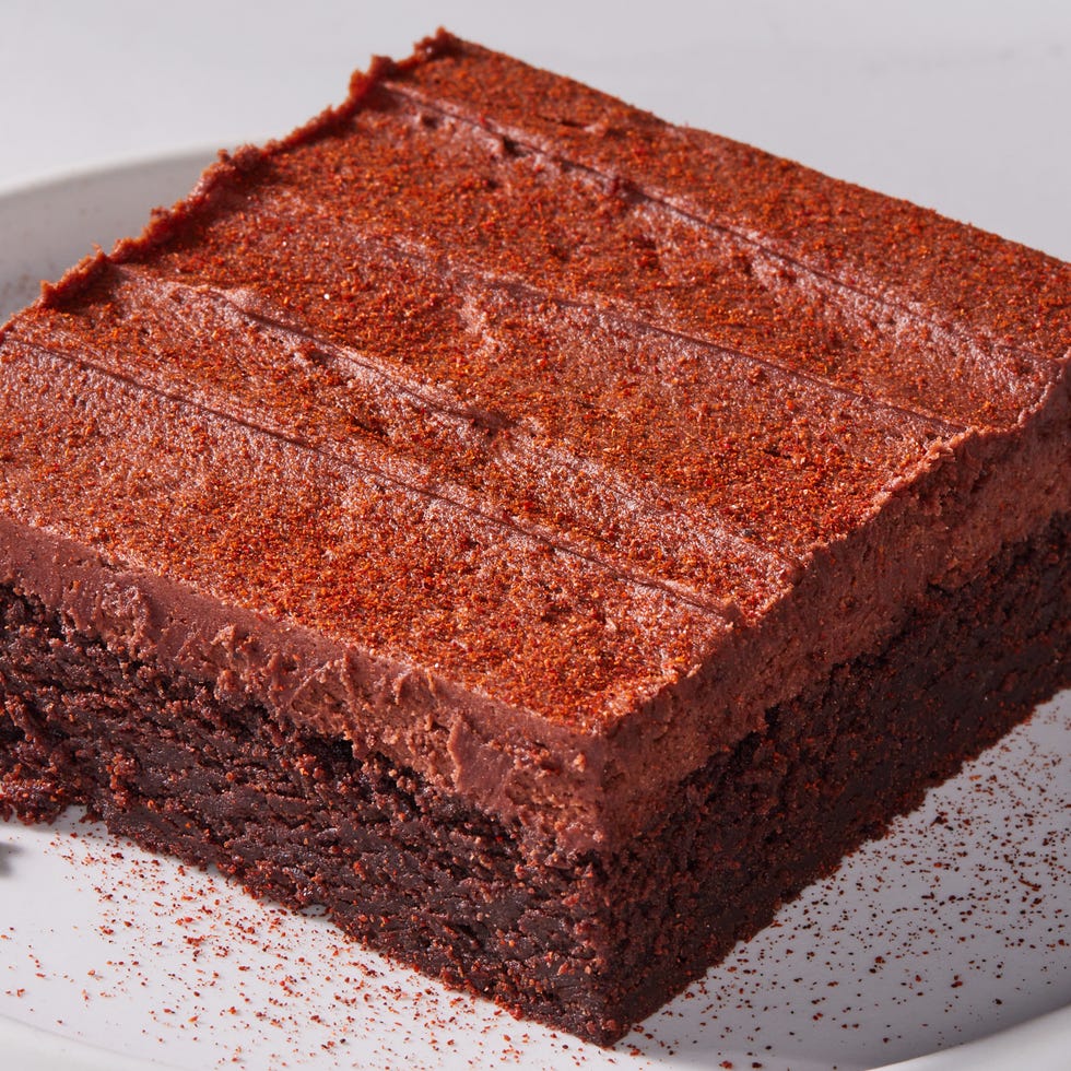 frosted hot chocolate brownies with a spice mix dusting on top