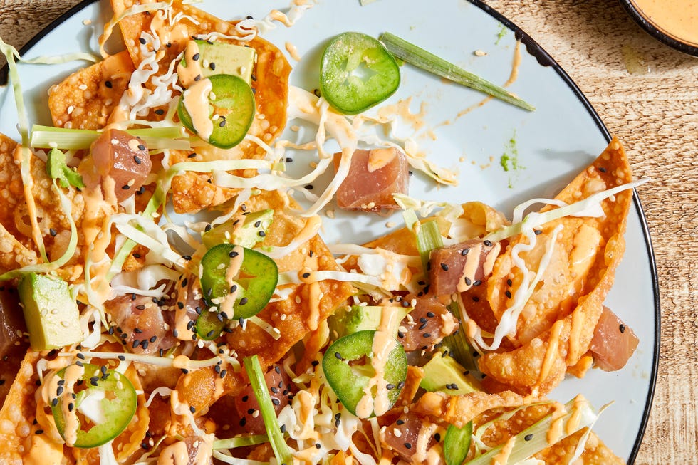 spicy ahi tuna nachos with cabbage, scallions and sesame seeds