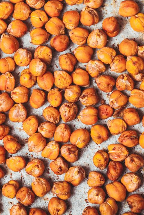 a baking sheet filled with sweet roasted maple cinnamon crunchy chickpeas, a healthy sweet snack