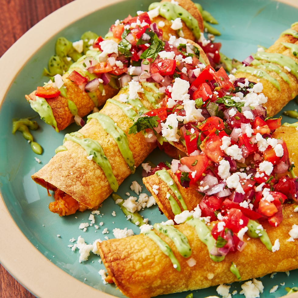 spicy chicken taquitos drizzled with an avocado cream sauce, pico de gallo, and queso fresco