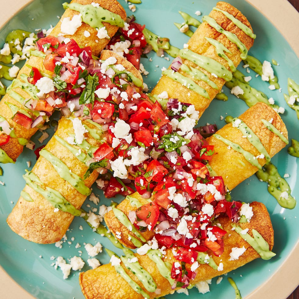 spicy chicken taquitos drizzled with an avocado cream sauce, pico de gallo, and queso fresco