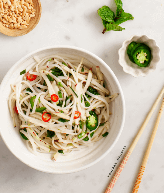 spicy kohlrabi noodles with slices of chile
