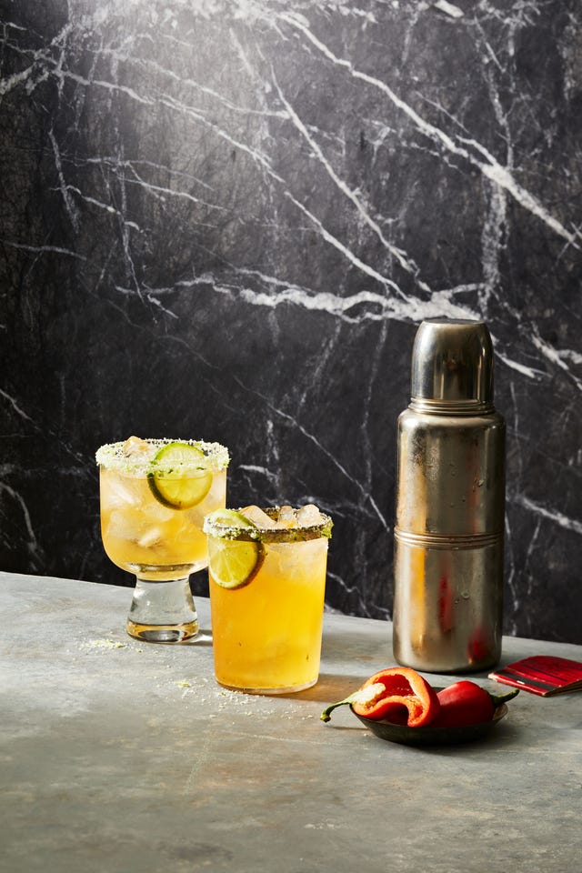 spicy margarita with cocktail shaker and chile pepper