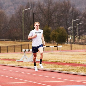 a runner Saucony running fast on a track