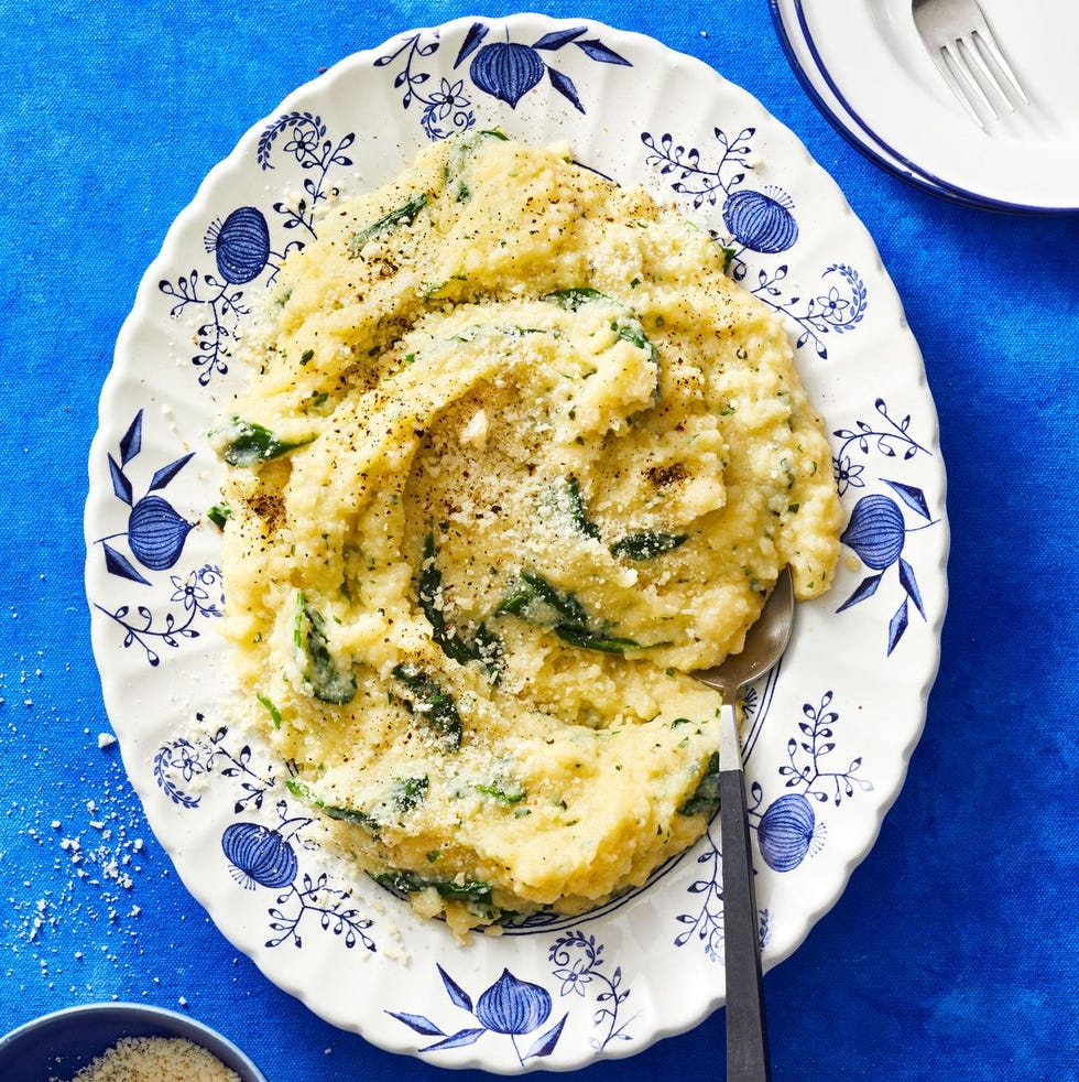 spinach herb polenta on a blue decorative plate