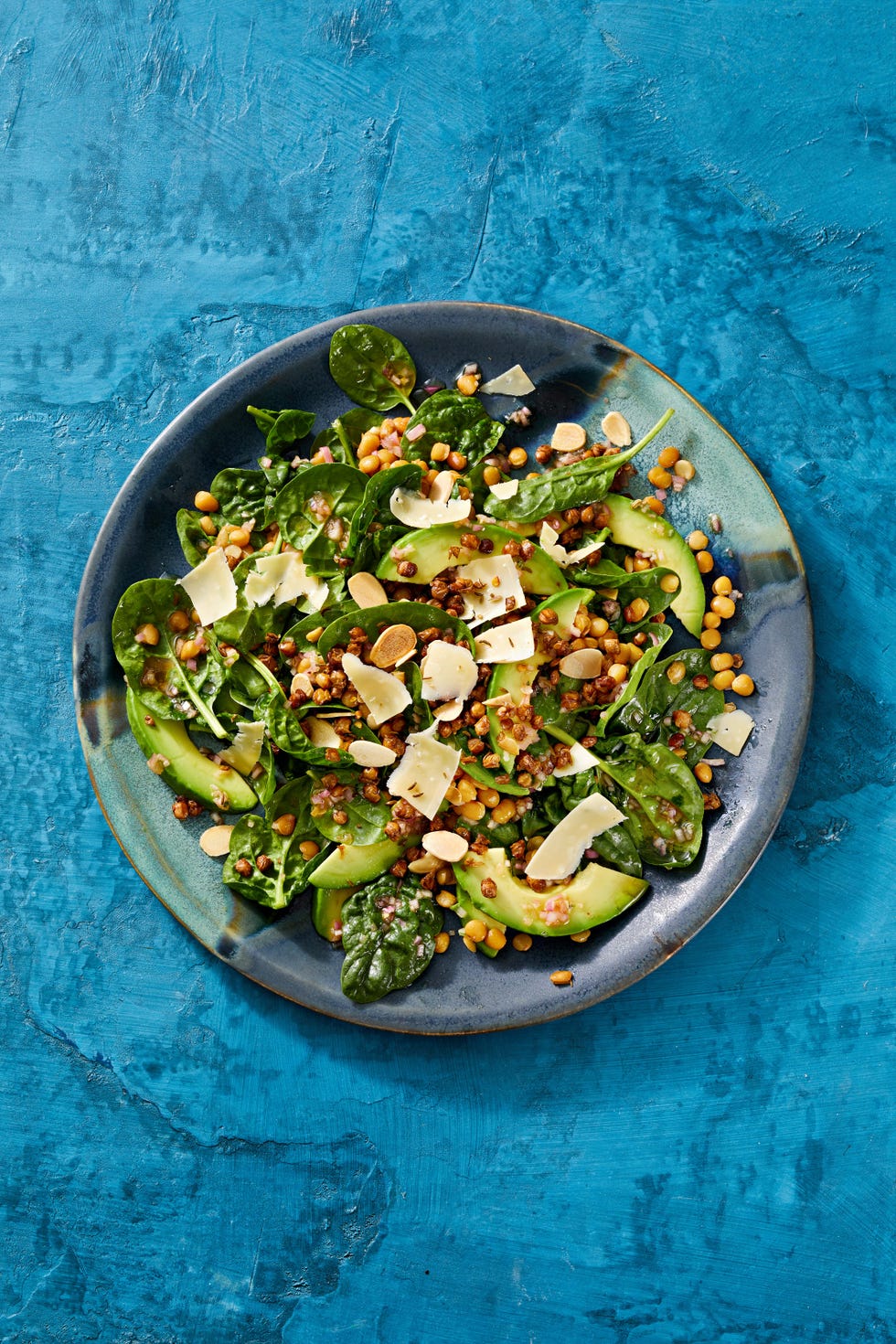 spinach salad with crispy lentils and aged gouda