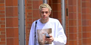 EXCLUSIVE: Pete Davidson wears a sweater with fiancee Ariana Grande's picture in front while out in New York City