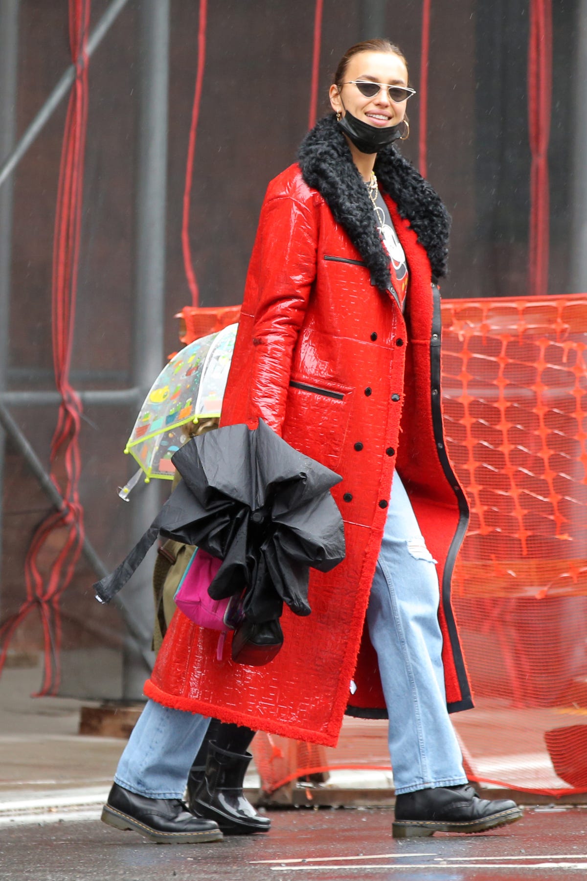 Irina Shayk looks stylish in red leather trech coat with black