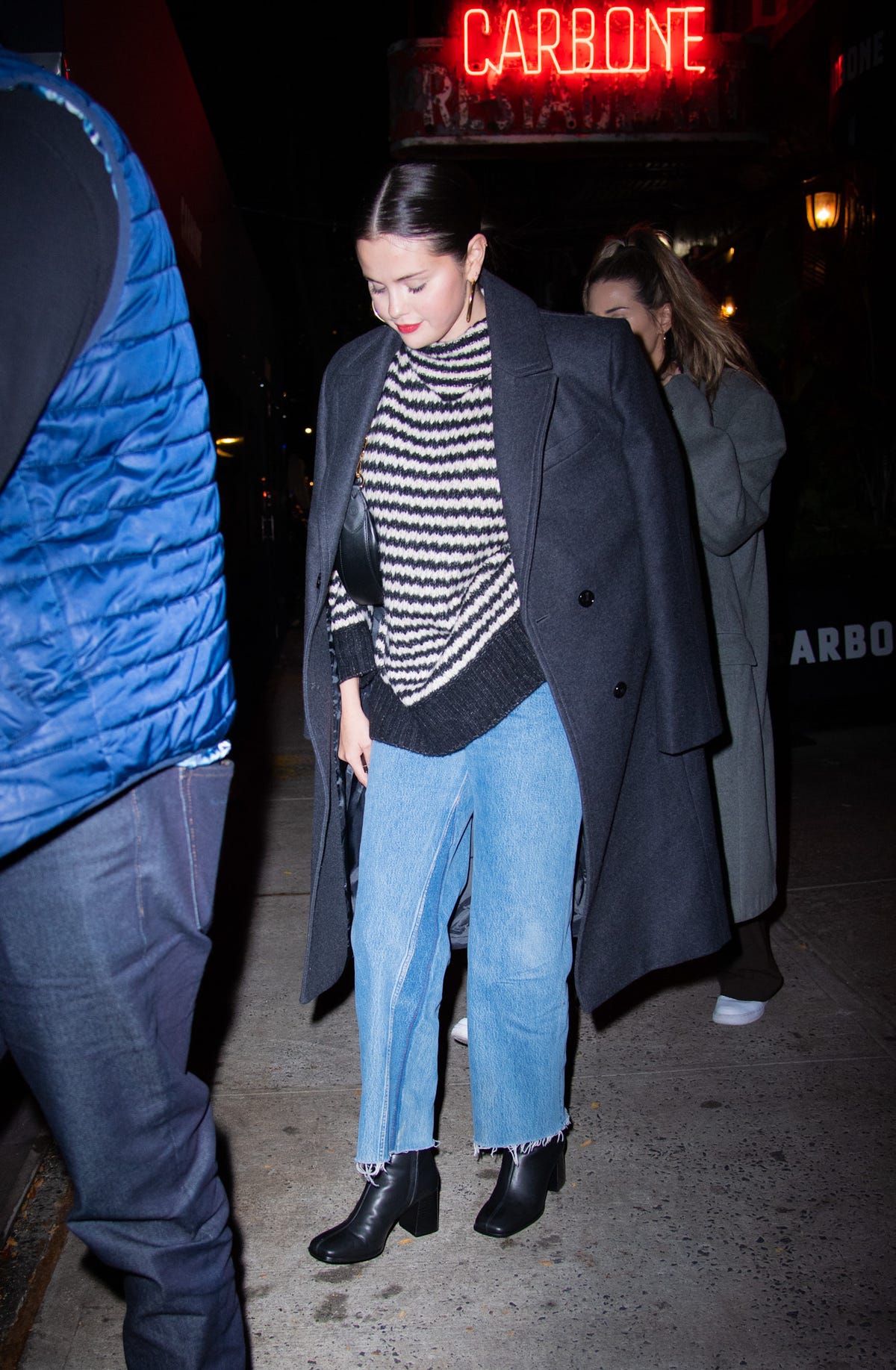 Selena Gomez rocks sleek bob and off-the-shoulder striped sweater