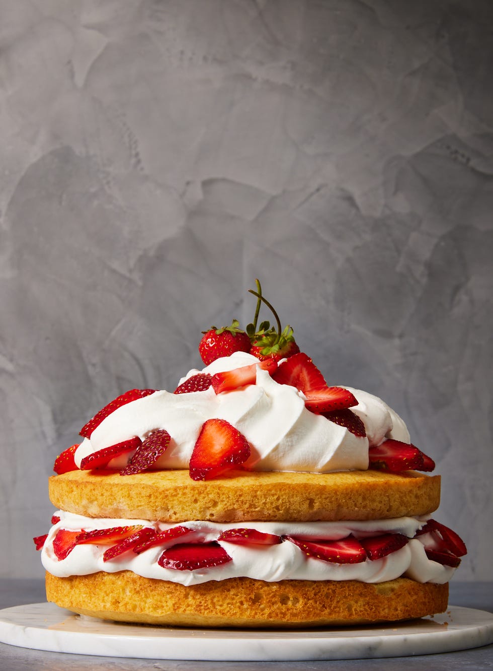 sponge cake with whipped cream and strawberries