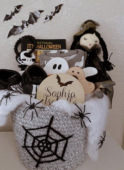 a baby spooky basket with teethers and dolls