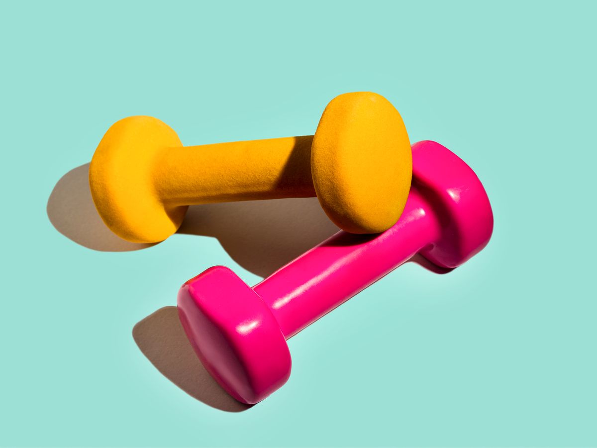 https://hips.hearstapps.com/hmg-prod/images/sport-lifestyle-concept-with-pink-yellow-dumbbells-royalty-free-image-1678649346.jpg?crop=0.88911xw:1xh;center,top&resize=1200:*