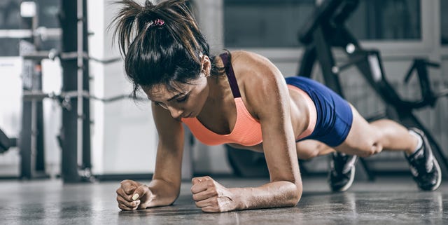 Sport. Muscular woman on a plank position. Sport. Muscular woman on a plank position.