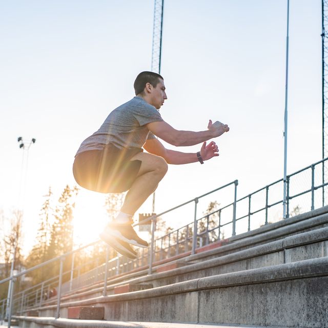 sportsman jumping on stairway outdoors