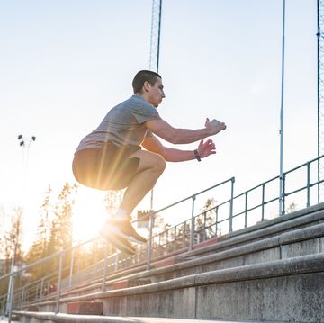sportsman jumping on stairway outdoors