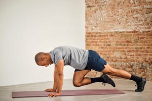 sportsman practicing mountain climbing exercise