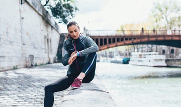 sportswoman checking her smart watch