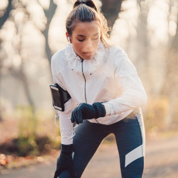 Sportswoman checking pulse Sportswoman checking pulse