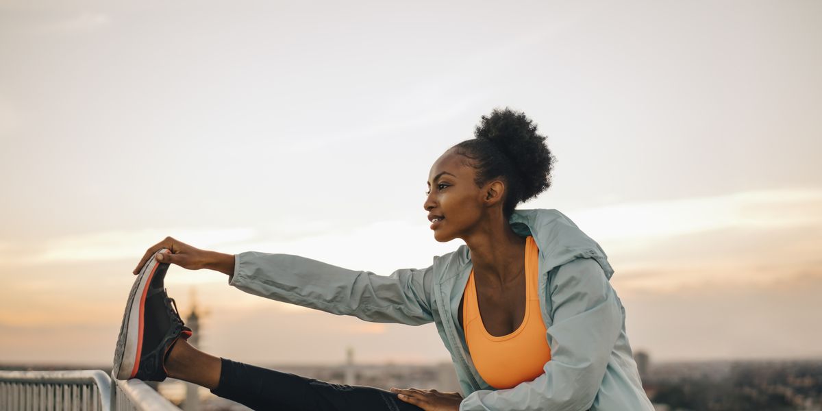 https://hips.hearstapps.com/hmg-prod/images/sportswoman-doing-stretching-exercise-against-sky-royalty-free-image-1752525537.pjpeg?crop=1.00xw:0.750xh;0,0.178xh&resize=1200:*
