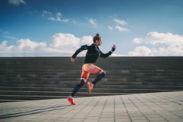 sportswoman sprinting in the city