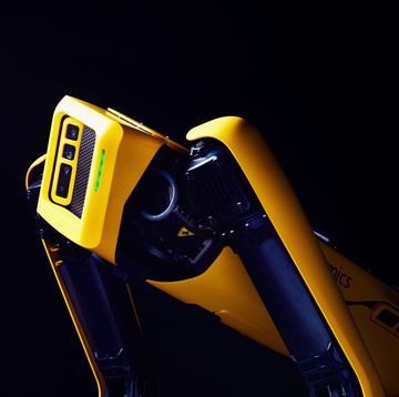 a yellow and black robot dog named spot, from the company boston dynamics