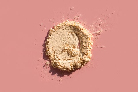 how to look younger spot of crushed face powder on pink background trendy selfcare products of the year