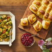 sweet and sour brussels sprouts, cranberry apple sauce, and orange thyme parker house rolls