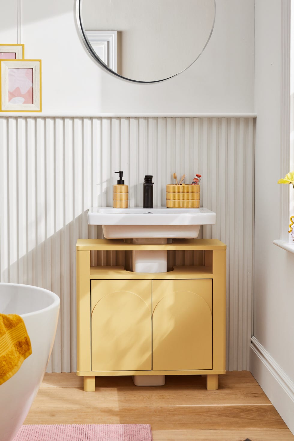 a small white shelf with objects on it