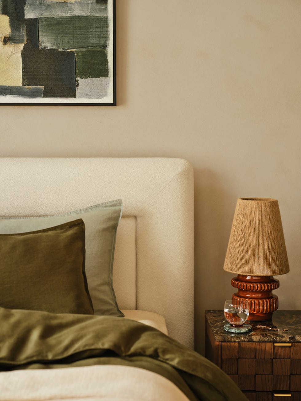 Bedroom corner with bed linen and decorative elements