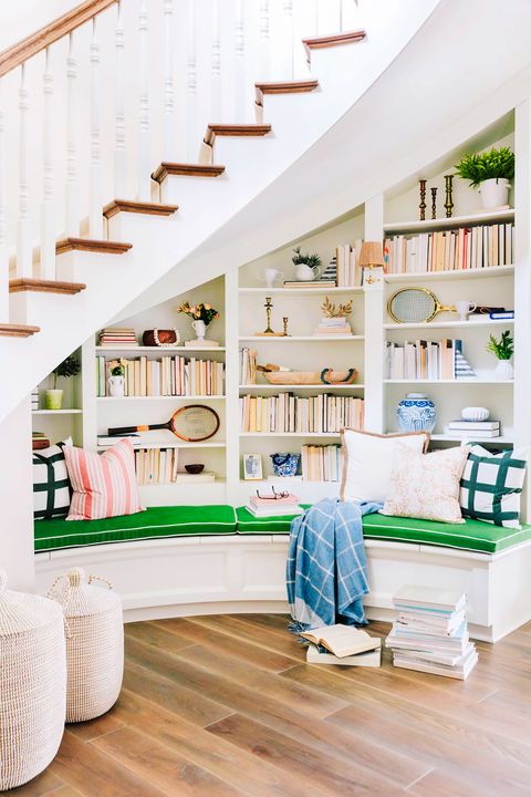 reading nook with custombuilt bench below a staircase