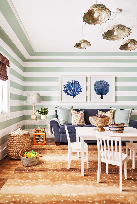 living roomsitting room with green and white stripes painted on walls