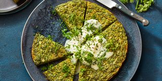 green herb spring frittata on a blue plate