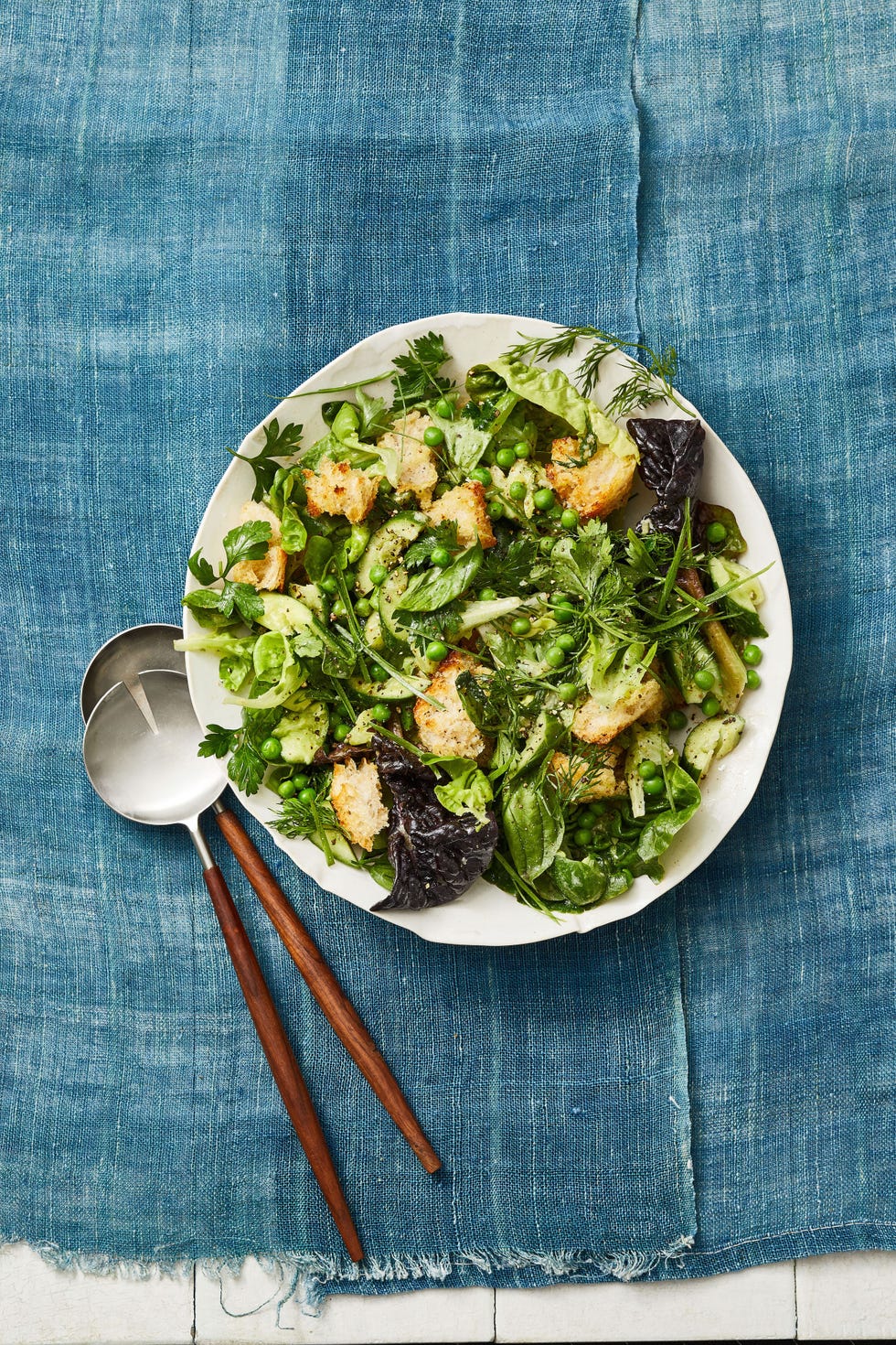 a plate of green spring panzanella with croutons