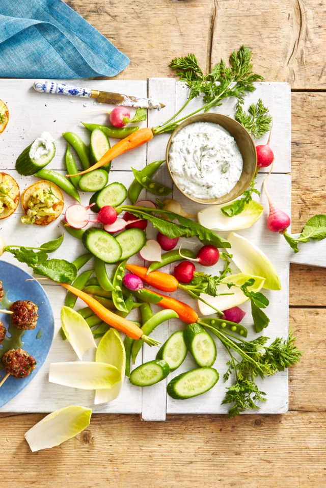 spring crudite with carrots, cucumber, radish and a white dip