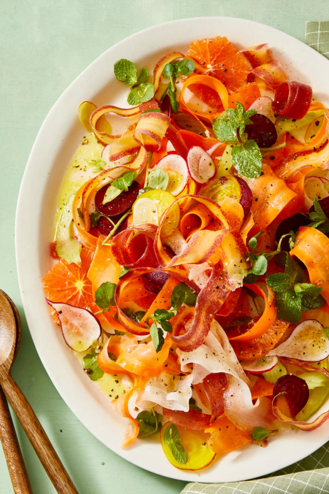 shaved carrot and radish salad on a white plate