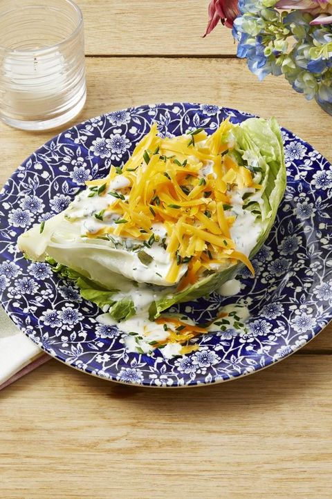wedge salad with buttermilk ranch dressing on blue plate