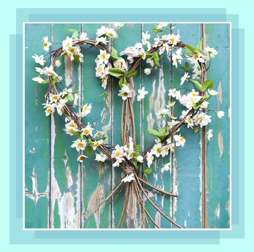 spring wreath with white flowers on blue door