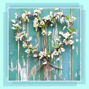 spring wreath with white flowers on blue door