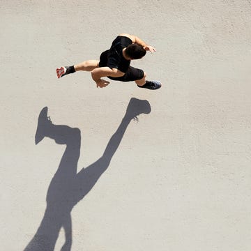 Sprinter seen from above with shadow and copy space. Sprinter seen from above with shadow and copy space.