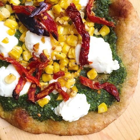 flatbread pizzas with pesto, corn, goat cheese and sundried tomatoes