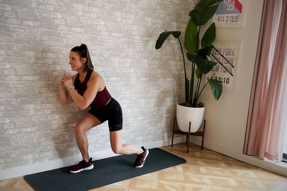 aerobic workout, amber rees performs squat to tap back exercise
