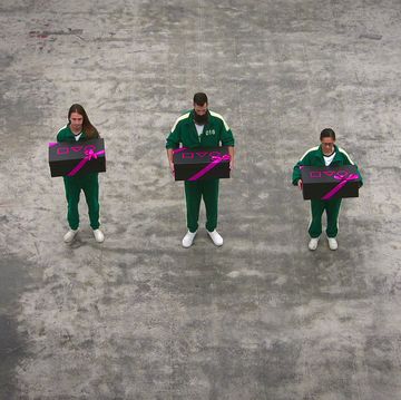 a group of people holding boxes