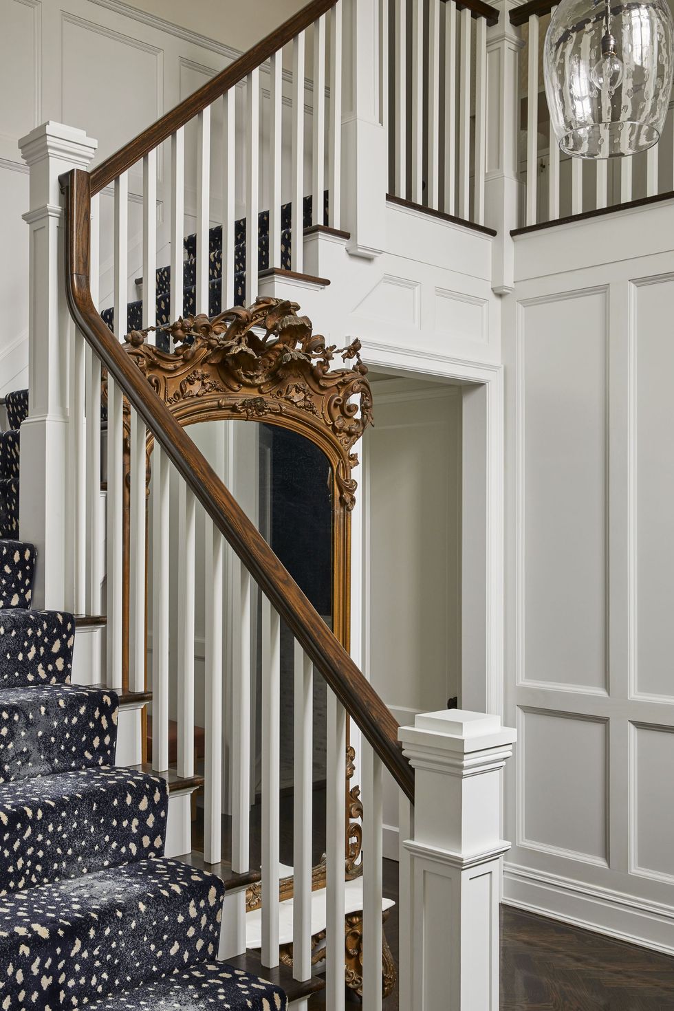 white painted walls with white crown moulding, stairway