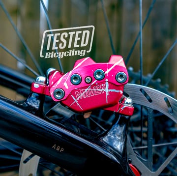 a pink toy on a bicycle wheel