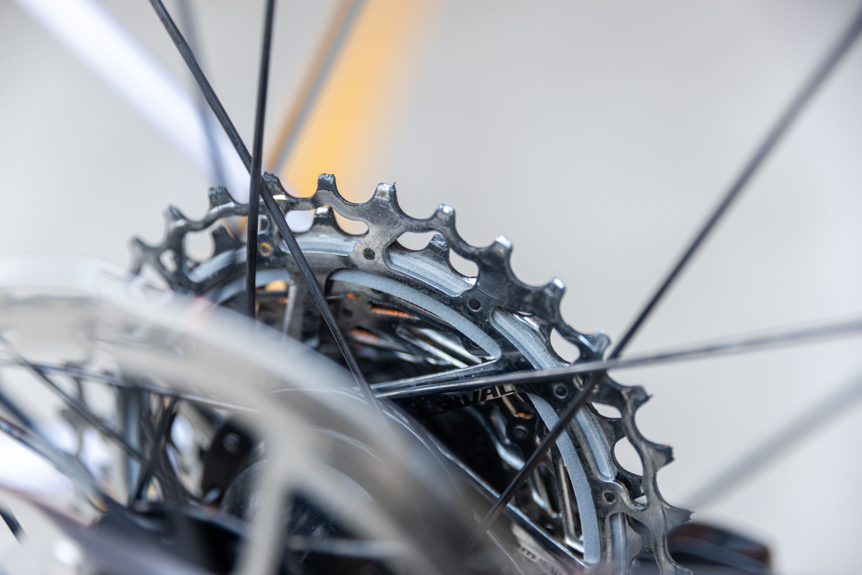 The Rival 12-speed cassette has a single sound damper ring (in gray) between the largest and second-largest cog. 