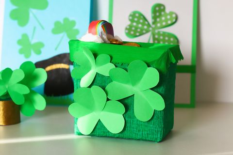 diy leprechaun trap with gold coins, rainbow and green ladder st patricks day background gift idea, decor saint patricks day step by step child kid craft process top view irish holiday